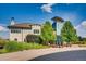 Beautiful clubhouse with architectural details, surrounded by lush greenery and manicured landscaping at 6777 S Old Hammer Ct, Aurora, CO 80016