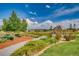 Picturesque community park with walking paths, lush landscaping, and a charming gazebo under a sunny sky at 6777 S Old Hammer Ct, Aurora, CO 80016