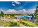 Inviting community pool area with slide and ample space for recreation on a sunny day at 6777 S Old Hammer Ct, Aurora, CO 80016