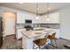 Well-equipped kitchen with stainless steel appliances, granite countertops, and a breakfast bar at 6777 S Old Hammer Ct, Aurora, CO 80016