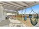 Covered back patio with concrete flooring, grill, and outdoor seating at 3732 S Halifax St, Aurora, CO 80013