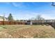 Backyard featuring a wooden fence, grass and a small shed at 3732 S Halifax St, Aurora, CO 80013