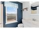 Bathroom with vanity sink, toilet, mirror and a bright window overlooking the backyard at 3732 S Halifax St, Aurora, CO 80013