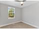 Neutral bedroom with carpet flooring, ceiling fan, and window with ample natural light at 3732 S Halifax St, Aurora, CO 80013