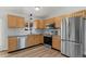 Modern kitchen features stainless steel appliances, stylish backsplash, and light wood cabinets at 3732 S Halifax St, Aurora, CO 80013