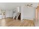 Bright and spacious living room with wood floors, white walls and stairs at 3732 S Halifax St, Aurora, CO 80013