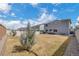 Large backyard with expansive lawn, wood and vinyl fences, and patio providing a great space for recreation at 5251 Truckee St, Denver, CO 80249