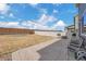 Spacious backyard with large concrete patio, barbecue and firepit offering ample room for outdoor entertainment at 5251 Truckee St, Denver, CO 80249