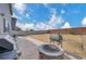 Large backyard with a barbecue, firepit, and both wood and vinyl fencing providing a serene outdoor space at 5251 Truckee St, Denver, CO 80249