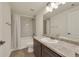Clean bathroom featuring a vanity with a sink and a shower with a tub at 5251 Truckee St, Denver, CO 80249