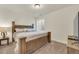 Cozy bedroom with a wood-framed bed, neutral-toned walls, and comfortable carpet at 5251 Truckee St, Denver, CO 80249