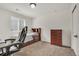 Comfortable bedroom featuring a twin bed, office chair and dresser, with neutral walls at 5251 Truckee St, Denver, CO 80249