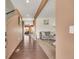 View of front entry, hardwood floors, and an open view of the living room, dining area, and stairs at 5251 Truckee St, Denver, CO 80249