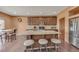 Kitchen with a large island, barstool seating, granite countertops, and stainless steel appliances at 5251 Truckee St, Denver, CO 80249