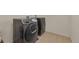 Laundry room featuring modern, matching Samsung washer and dryer appliances set against neutral walls and flooring at 5251 Truckee St, Denver, CO 80249
