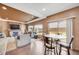 Cozy living room and dining room with ample natural light with a fireplace and outdoor access at 5251 Truckee St, Denver, CO 80249