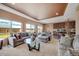 Spacious living room featuring comfortable seating, natural light, and open layout to the dining area at 5251 Truckee St, Denver, CO 80249