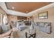 Inviting living room featuring an open layout to a modern kitchen and neutral decor at 5251 Truckee St, Denver, CO 80249
