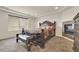 Spacious main bedroom featuring a large decorative bed frame, fireplace, and scenic views at 5251 Truckee St, Denver, CO 80249