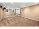 The carpeted basement offers a blank canvas with recessed lights and a large screen at 2698 E Cresthill Ave, Centennial, CO 80121