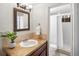 Charming bathroom features a decorative mirror, tiled countertop, and walk-in shower at 2698 E Cresthill Ave, Centennial, CO 80121