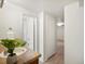 Bright bathroom features a tiled countertop, walk-in shower, and neutral walls at 2698 E Cresthill Ave, Centennial, CO 80121
