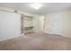 This bedroom has a closet, built-in desk, and neutral carpet at 2698 E Cresthill Ave, Centennial, CO 80121