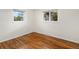 Bedroom showcasing hardwood floors and bright windows for a warm and inviting feel at 2698 E Cresthill Ave, Centennial, CO 80121