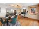 The dining area showcases hardwood flooring and is centrally located between living areas at 2698 E Cresthill Ave, Centennial, CO 80121