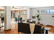 Open floor plan with dining area, hardwood flooring, and natural light throughout at 2698 E Cresthill Ave, Centennial, CO 80121
