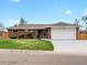 Charming brick home featuring a well-maintained lawn and an attached two-car garage at 2698 E Cresthill Ave, Centennial, CO 80121