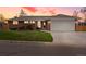 Charming brick home featuring a well-maintained lawn and an attached two-car garage at 2698 E Cresthill Ave, Centennial, CO 80121