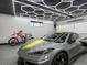 Stylish garage with modern lighting, epoxy flooring, car and motorcycle at 2698 E Cresthill Ave, Centennial, CO 80121
