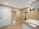 This is a convenient laundry room featuring a utility sink, storage shelf, and a practical layout at 2698 E Cresthill Ave, Centennial, CO 80121