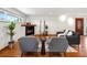 Bright living room with fireplace, wood floors, modern furnishings, and a cozy, inviting atmosphere at 2698 E Cresthill Ave, Centennial, CO 80121