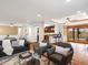 Open-concept living area with hardwood floors flowing into the connected kitchen and dining area at 2698 E Cresthill Ave, Centennial, CO 80121