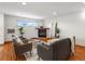 Well-lit living room features hardwood floors, a fireplace and an inviting atmosphere at 2698 E Cresthill Ave, Centennial, CO 80121