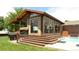 A covered outdoor living space features retractable screens and access to a refreshing pool at 2698 E Cresthill Ave, Centennial, CO 80121