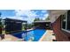 Relax by the in-ground pool, complete with an outdoor living area and a built-in grill at 2698 E Cresthill Ave, Centennial, CO 80121