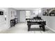 Finished basement with foosball table, stylish decor, and sliding barn door to additional bedroom at 11354 Allendale Dr, Arvada, CO 80004