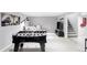 Finished basement featuring a foosball table, comfortable seating area, and a modern entertainment setup at 11354 Allendale Dr, Arvada, CO 80004