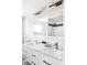 Elegant bathroom featuring double sinks, marble countertops, modern fixtures, and a spacious shower with black accents at 11354 Allendale Dr, Arvada, CO 80004