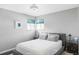 Cozy bedroom featuring a comfortable bed, side tables with lamps, and natural light from the windows at 11354 Allendale Dr, Arvada, CO 80004