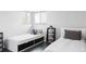 Bright bedroom with hardwood floors featuring two twin beds and a side table with books and a plant at 11354 Allendale Dr, Arvada, CO 80004