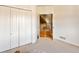 Bedroom with closet doors leading to an upstairs staircase at 931 Forest View Rd, Monument, CO 80132
