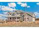 Charming home exterior featuring a lovely wraparound porch and professionally landscaped yard at 931 Forest View Rd, Monument, CO 80132