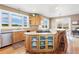 Kitchen with an island, light wood cabinets, stainless steel appliances, and views at 931 Forest View Rd, Monument, CO 80132