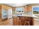 Kitchen with granite countertops, white appliances, and light wood cabinets at 931 Forest View Rd, Monument, CO 80132