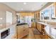 Spacious kitchen featuring granite counters, gas cooktop, and stainless appliances at 931 Forest View Rd, Monument, CO 80132