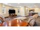 Finished basement living room offering a bar area, large TV, and comfortable leather seating at 931 Forest View Rd, Monument, CO 80132